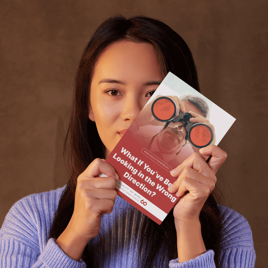 Woman holding Quality of Mind ebook